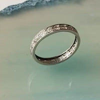 Antique platinum diamond band with engraved leaf pattern and old cut stones, English c.1930s