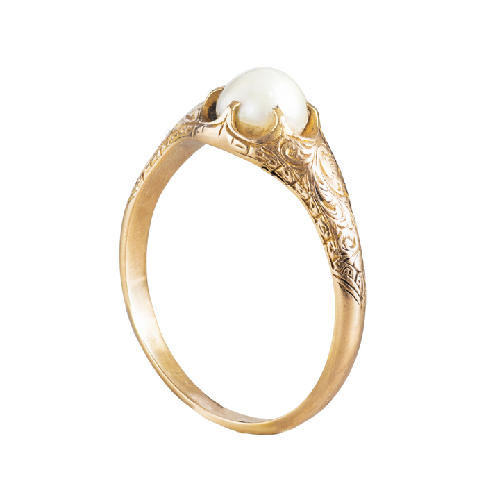 Victorian natural pearl ring with decorative gold setting and floral detail