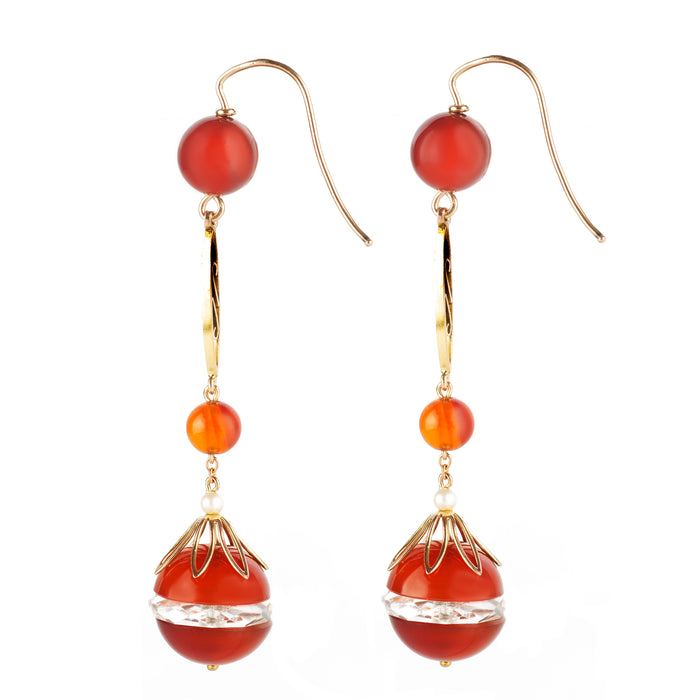Long French earrings featuring glowing carnelian and faceted rock crystal.