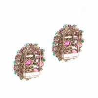 Reverse view of the Dorrie Nossiter garnet and turquoise dress clips, showing the silver clip fittings.