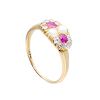 Side view of 18ct gold vintage ring featuring rubies, pearls and diamonds in an oval cluster setting