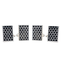 Pair of British silver cufflinks with black enamel scallop pattern, hallmarked Birmingham 1995.
