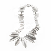 Bold sterling silver collar necklace featuring tapered oval beads