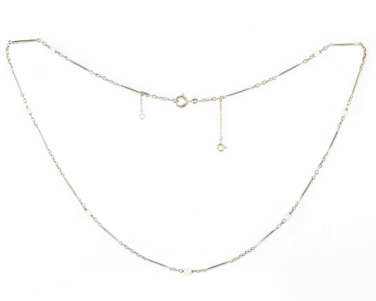 French 1920s necklace with platinum bar links, natural pearls, and 18ct gold.