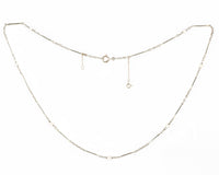 French 1920s necklace with platinum bar links, natural pearls, and 18ct gold.