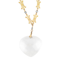 Late 1930s rock crystal heart pendant necklace with 9ct gold chain and sapphires.
