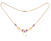Delicate antique gold necklace featuring white and pink enamel, amethysts, and floral detail, likely English or Austrian.