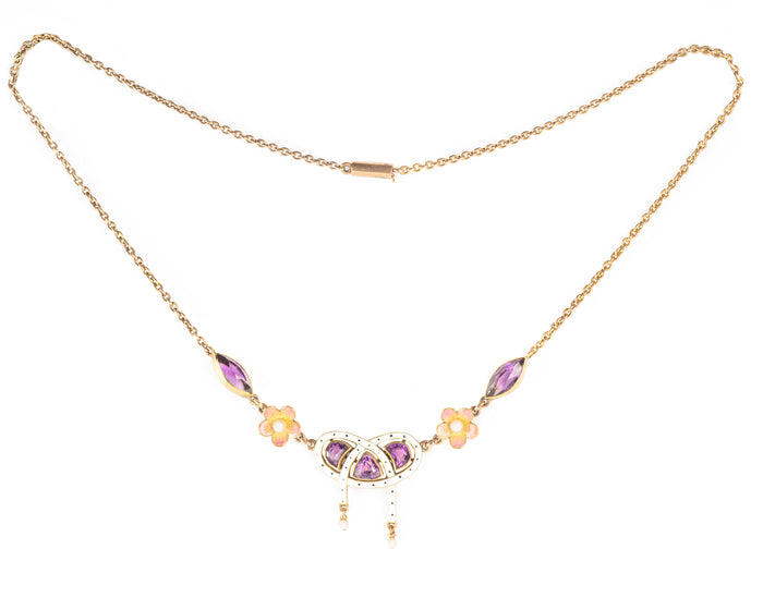 Delicate antique gold necklace featuring white and pink enamel, amethysts, and floral detail, likely English or Austrian.