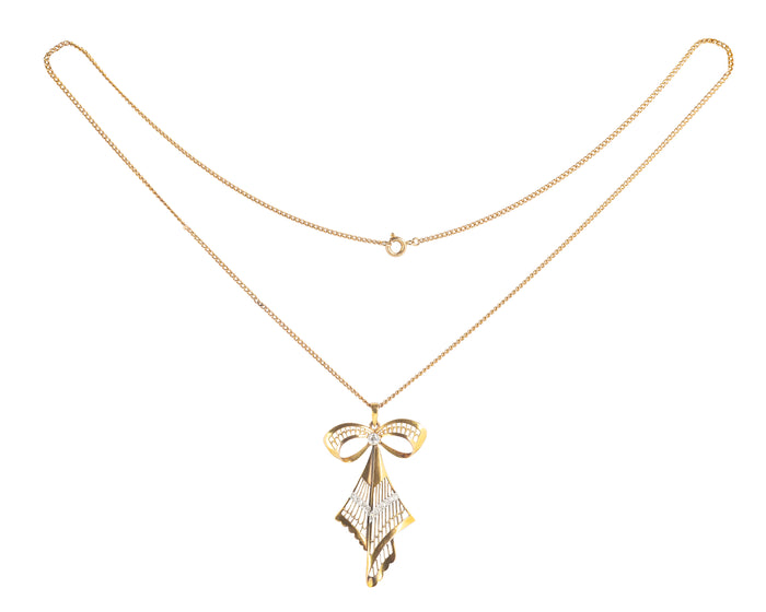 Vintage gold and diamond bow necklace, sculptural openwork form, German c.1960s.