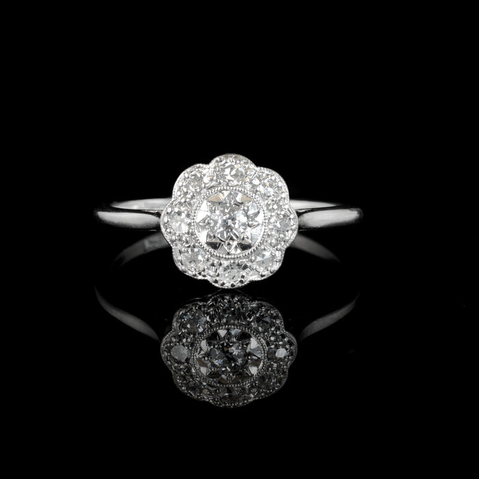 1940s platinum diamond daisy cluster ring with milgrain detail
