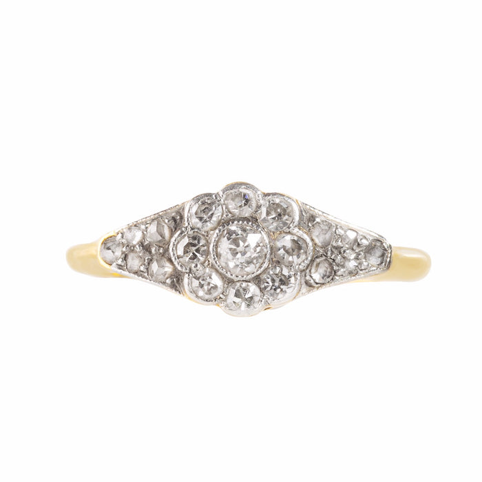 Edwardian diamond daisy ring with old cut stones and tapered shoulders
