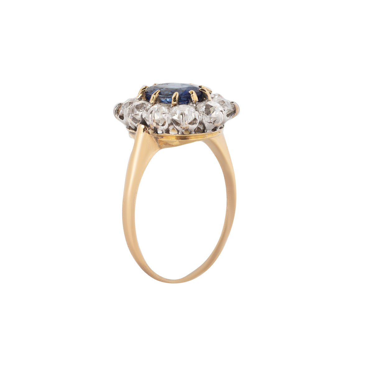 Oval cut Ceylon sapphire ring with old European cut diamond halo