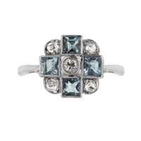 1950s British aquamarine and diamond ring in 18ct gold with platinum cross motif setting