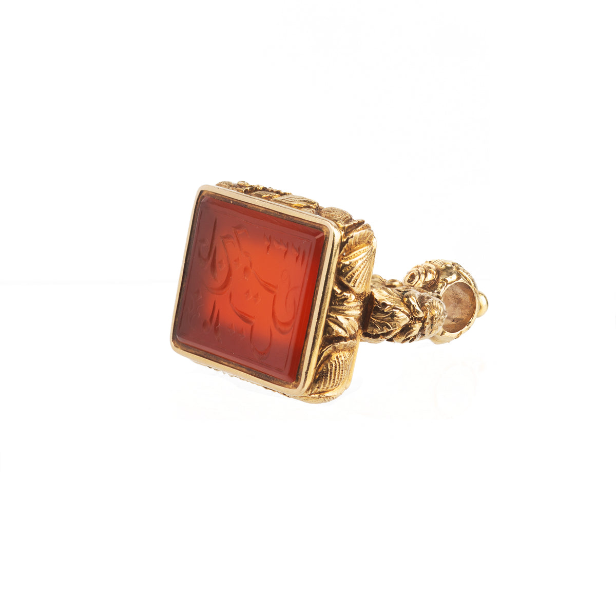 Close-up of Victorian intaglio seal in rich gold with finely engraved Persian script on carnelian.