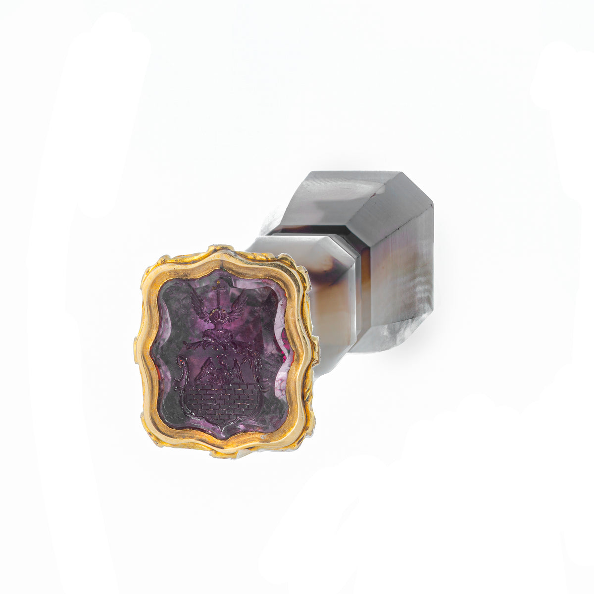 Antique gold desk seal featuring a richly banded agate body and heraldic amethyst sealstone.