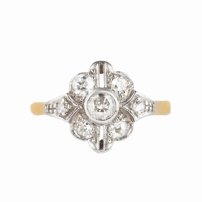 1930s Art Deco diamond ring with floral compass motif in platinum and gold