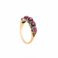 Side view of 1850s Victorian ruby and diamond ring with rose-cut diamonds and warm gold setting