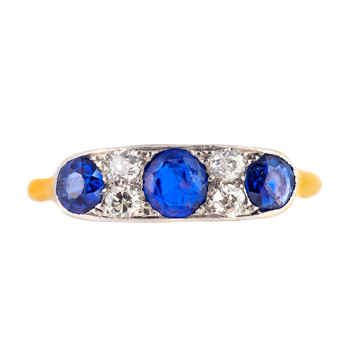 Edwardian 7-stone ring with alternating sapphires and old cut diamonds in 18ct gold, English c.1910