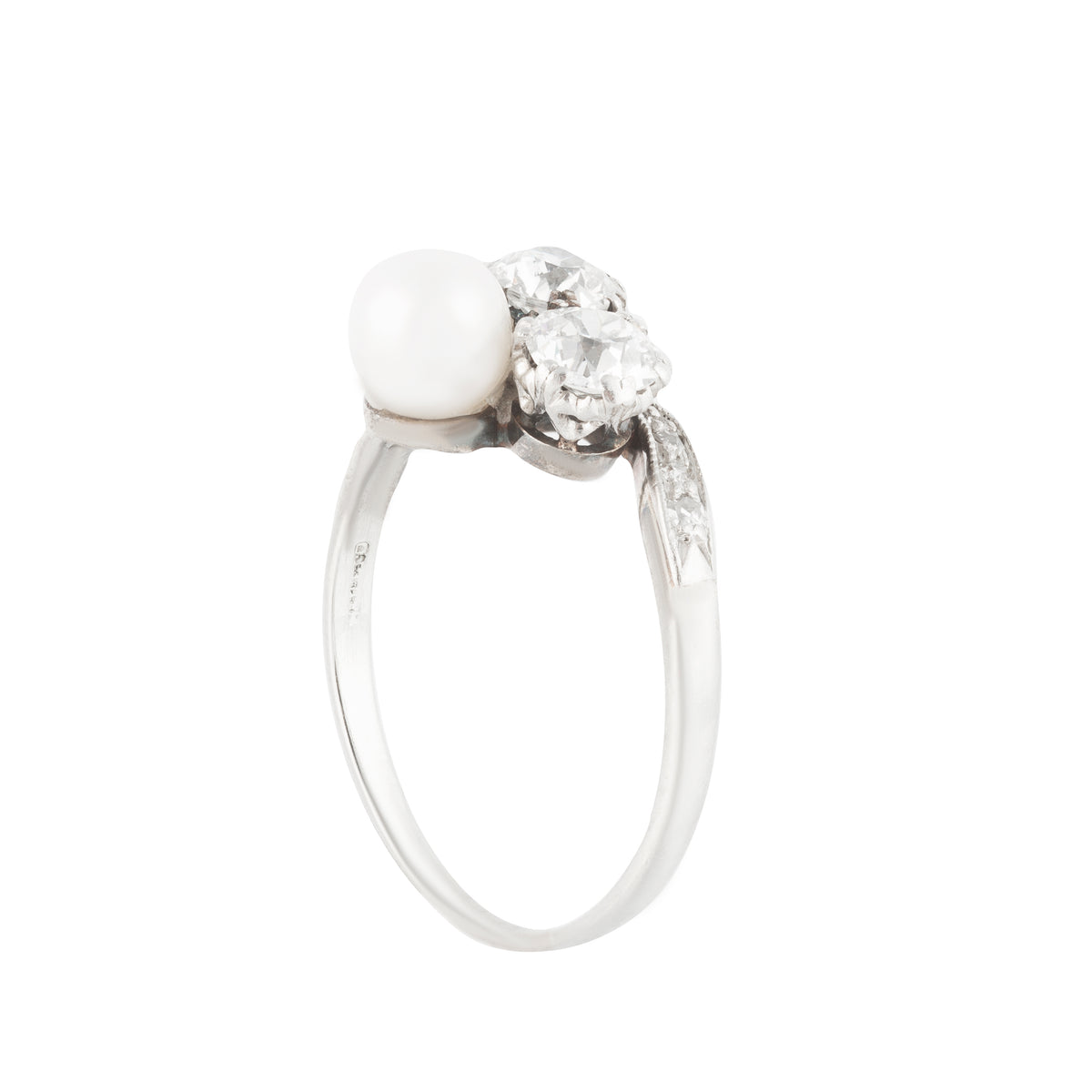 British Art Deco era pearl and diamond ring featuring a twist design and platinum shoulders