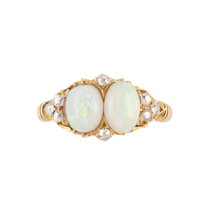 Edwardian double-opal and diamond ring in 18ct gold, featuring two matched oval cabochon opals framed by antique-cut diamonds, hallmarked Birmingham 1903.