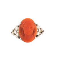 Arts and Crafts silver ring set with a carved Mediterranean coral cameo, c.1900.