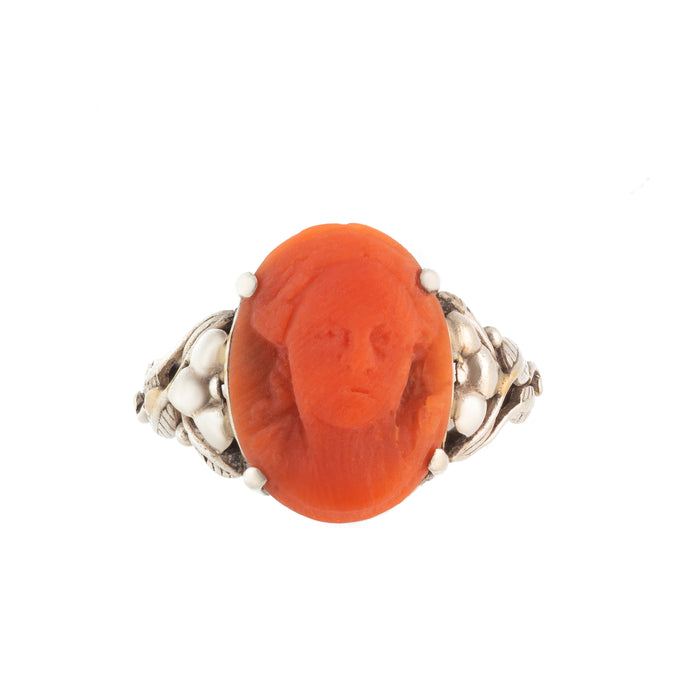 Arts and Crafts silver ring set with a carved Mediterranean coral cameo, c.1900.