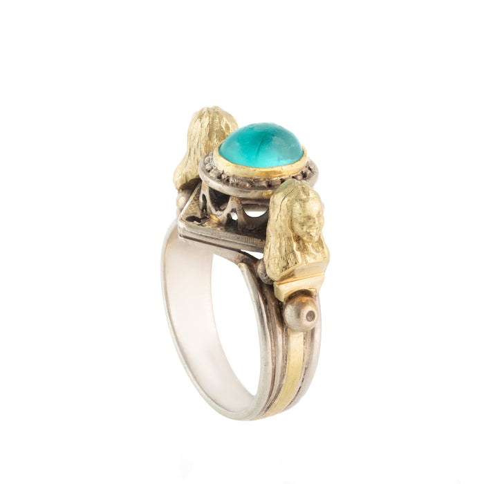 Silver and gold Egyptian Revival ring with blue apatite cabochon and lion head details, c.1970s.