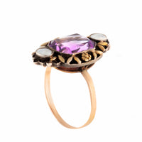 Vintage gold and silver ring featuring a 5.5ct amethyst and pearl accents, Arts and Crafts design with floral detailing.