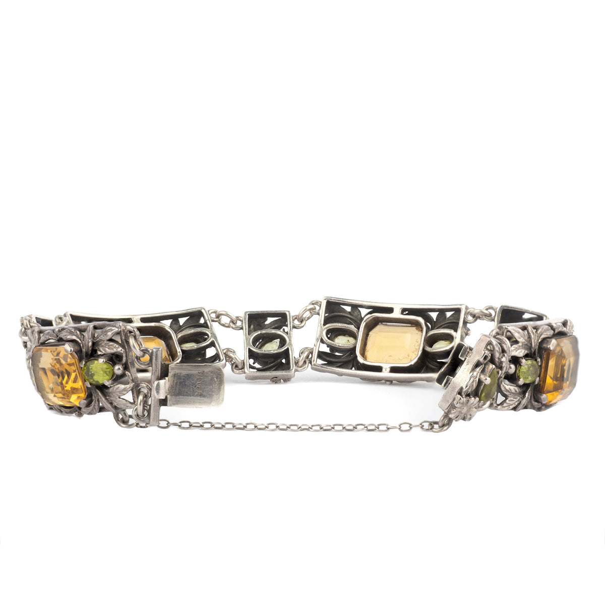 Vintage British floral bracelet in silver with golden citrine and green peridot stones