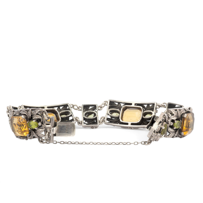 Vintage British floral bracelet in silver with golden citrine and green peridot stones