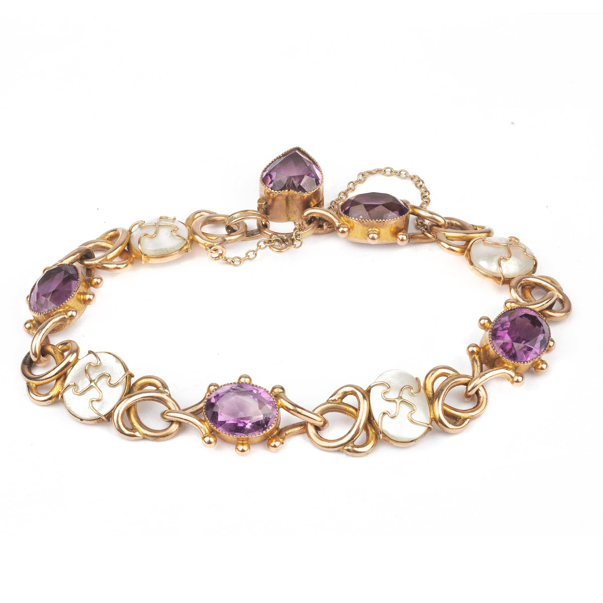 Antique gold bracelet set with approx. 14 carats of amethyst, mother-of-pearl, and a heart-shaped clasp, c.1920s.