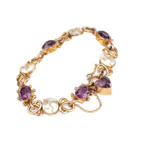 1920s English bracelet in 15ct gold with amethysts, mother-of-pearl panels, and heart-cut amethyst clasp.