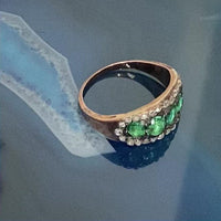 Rotating view of late Georgian emerald and diamond ring c.1820, showing five emeralds and rose cut diamonds in silver and gold mount.