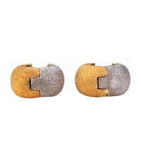 Vintage Italian earrings in two-tone textured gold with sculptural hoop form