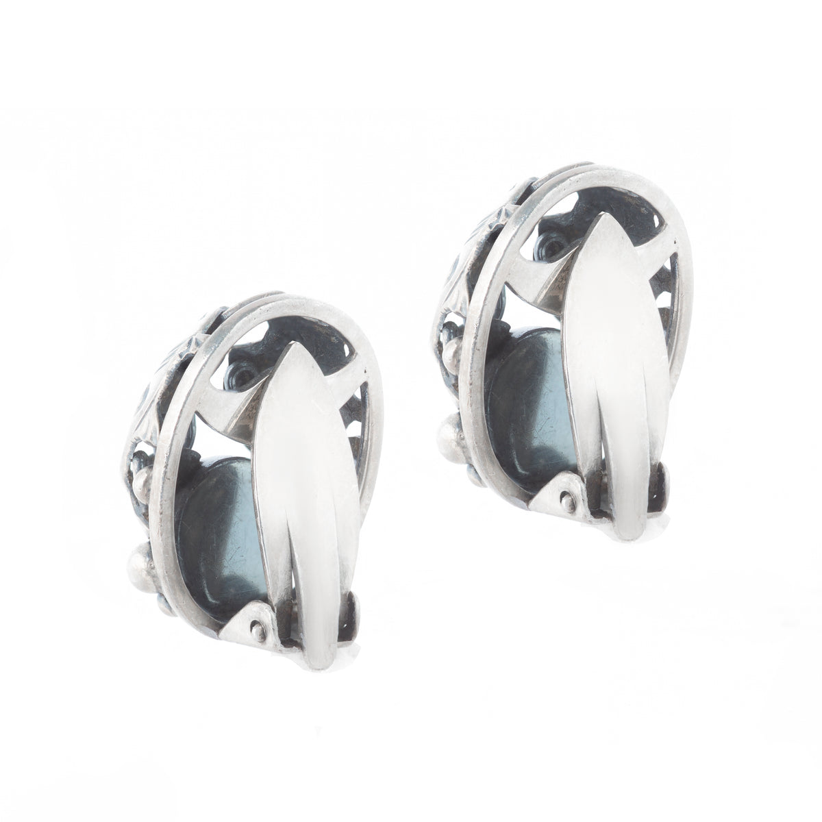 Back of silver clip-on earring with domed Baltic amber cabochon by Niels Erik From