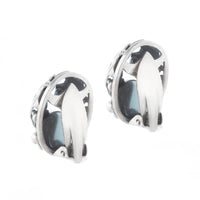 Back of silver clip-on earring with domed Baltic amber cabochon by Niels Erik From