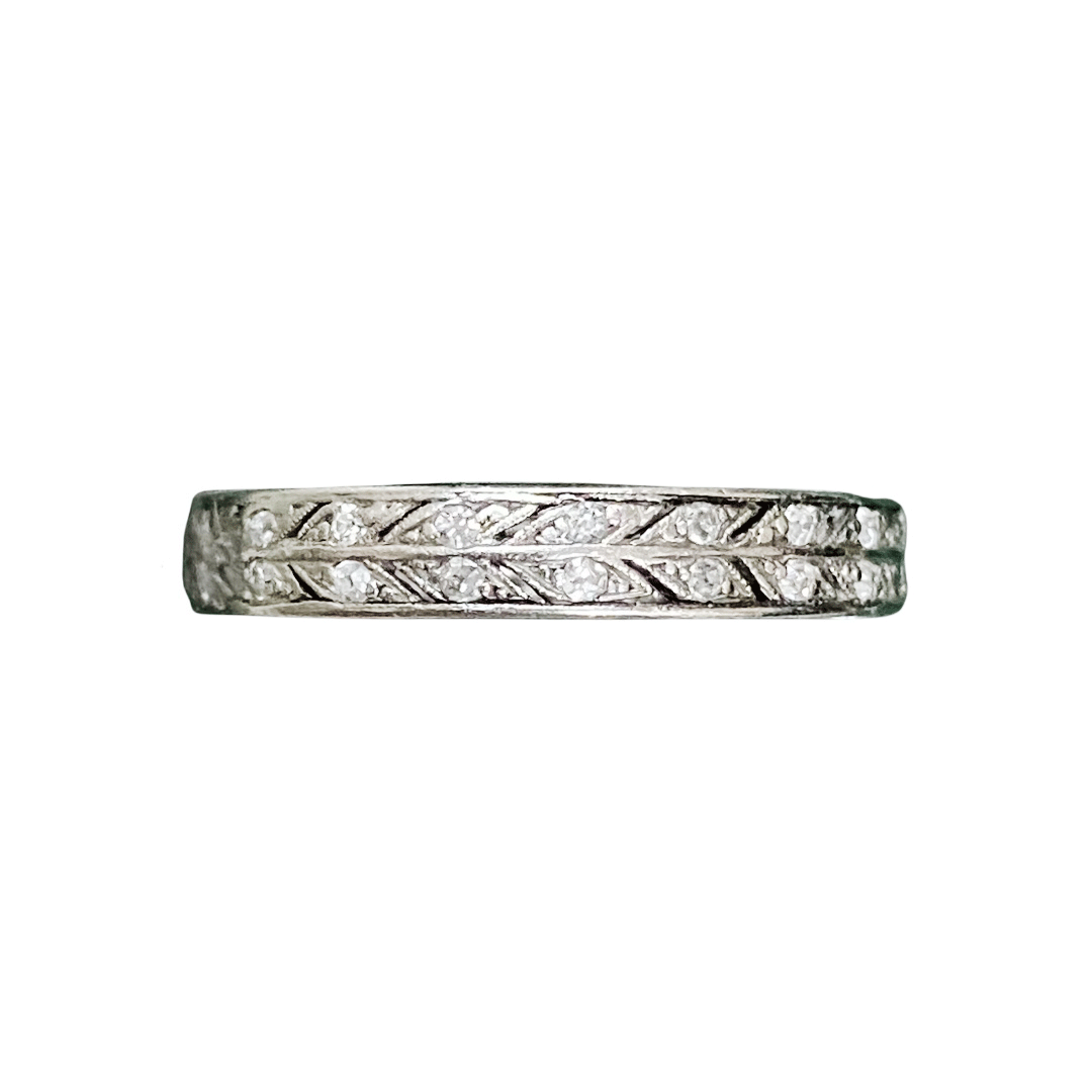 1930s platinum eternity ring with two rows of old cut diamonds and millegrain leaf engraving