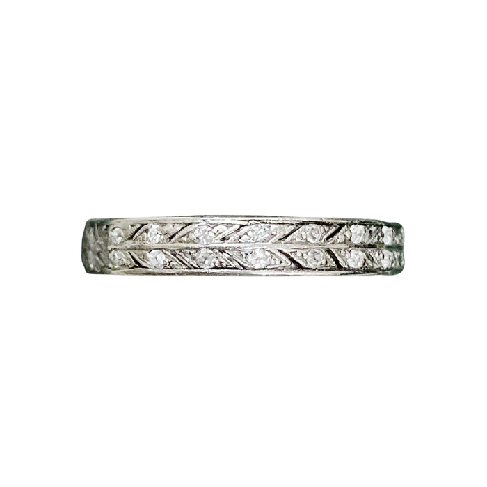 1930s platinum eternity ring with two rows of old cut diamonds and millegrain leaf engraving