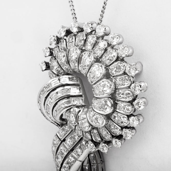 Convertible white gold brooch pendant with 6.95ct of diamonds in sculptural volute and tassel design