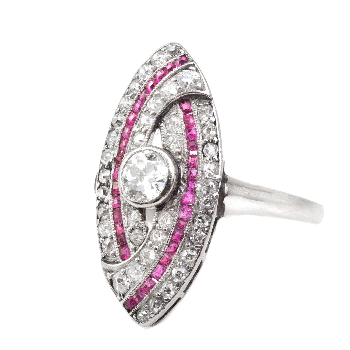 Art Deco marquise ring in platinum with old cut diamonds and channel set rubies, front view showing elongated oval shape and geometric design.