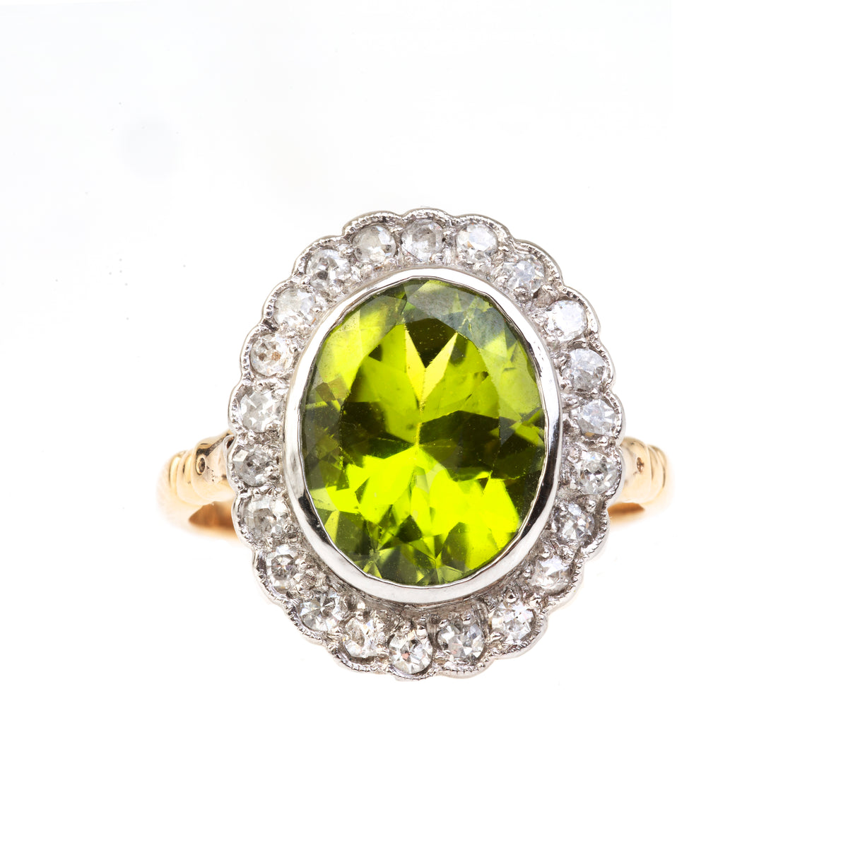 Edwardian peridot and diamond ring in 18ct gold and platinum, English, c.1910.