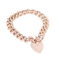 Antique gold bracelet with alternating engraved curb links and original heart-shaped padlock, Edwardian era