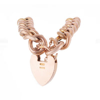 1910s Edwardian 9ct gold curb bracelet featuring textured links and heart padlock clasp, 18cm long
