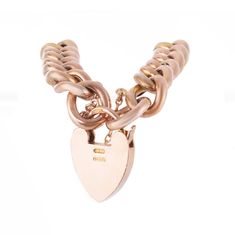 1910s Edwardian 9ct gold curb bracelet featuring textured links and heart padlock clasp, 18cm long
