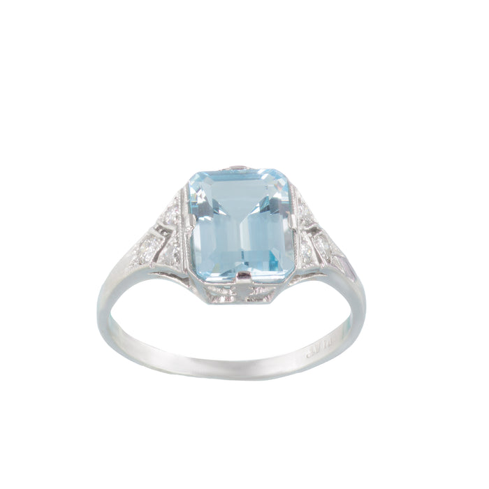 1950s aquamarine and diamond ring in platinum, British made, with a 2.5 carat emerald-cut aquamarine and millegrain detail