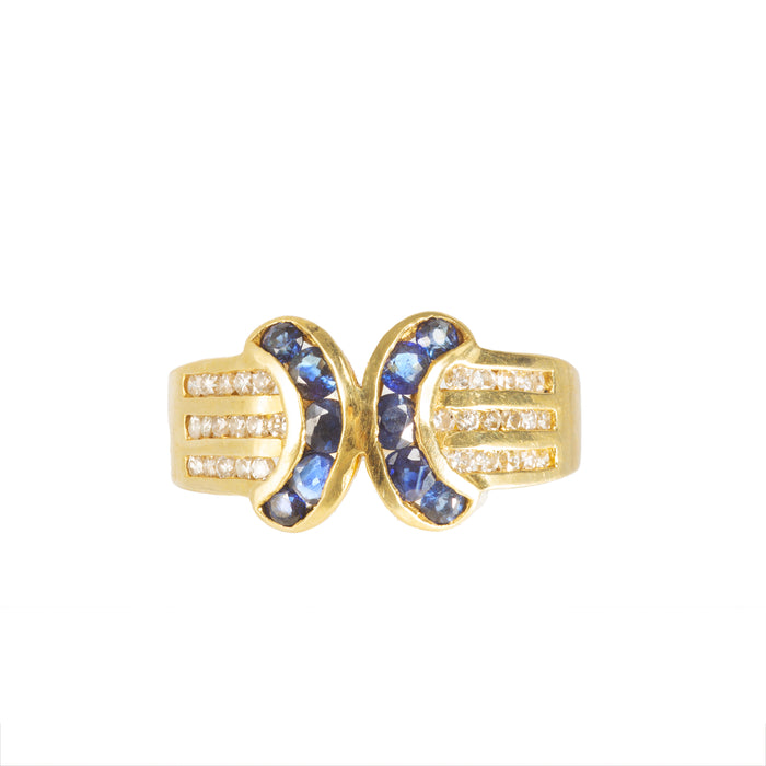 * Deep blue sapphire halo ring with diamond surround, 18ct gold