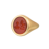 Front view of a 1963 English 18ct gold signet ring with carnelian intaglio carved with two heraldic crests.