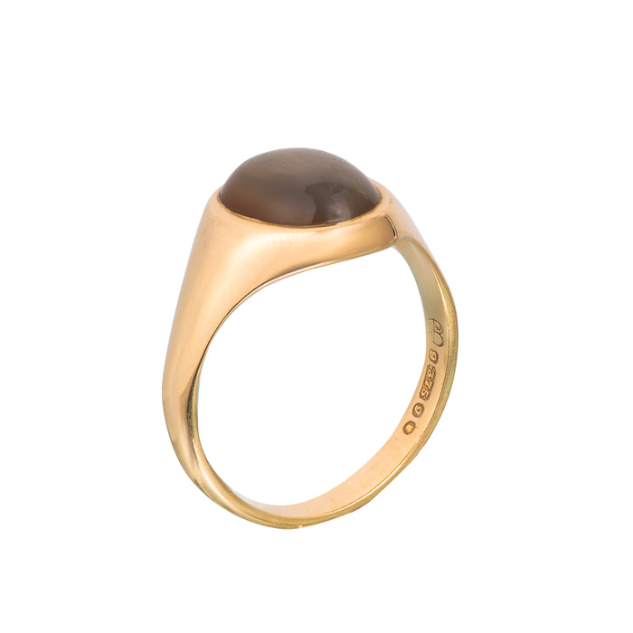 Side view of gold agate signet ring showing cabochon cut stone and tapered shoulders, hallmarked 1980s
