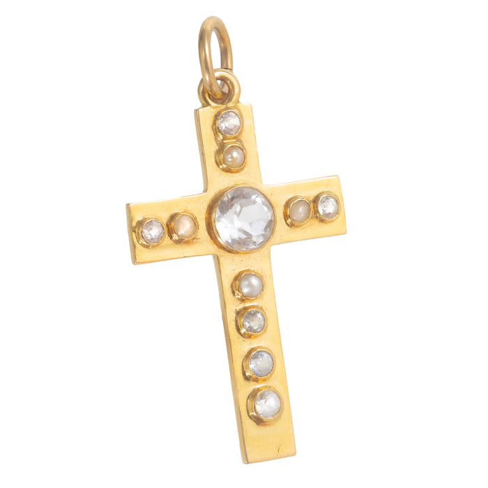 Early Art Deco 18ct gold cross pendant set with a central rose cut rock crystal, framed by seed pearls and smaller rose cut crystals, English c.1920s.