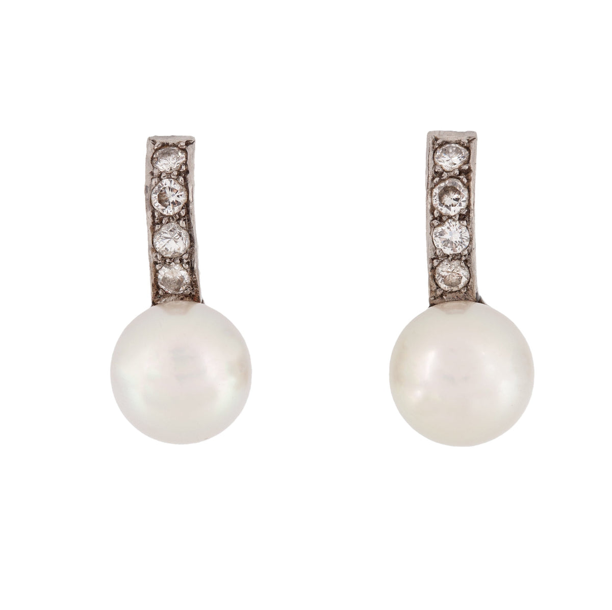 Elegant 1940s Italian clip on earrings in 18ct gold, each set with a lustrous pearl and three old European cut diamonds in a curved mount.